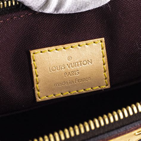 louis vuitton tag inside bag.